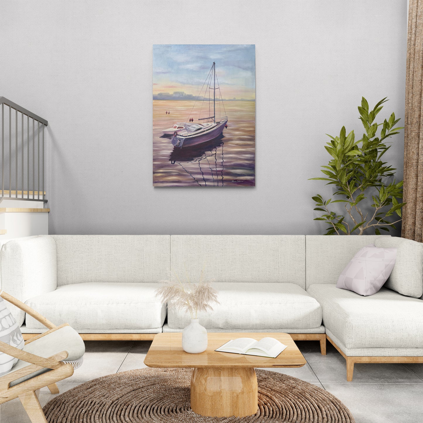 A painting on the wall above the wide white sofa