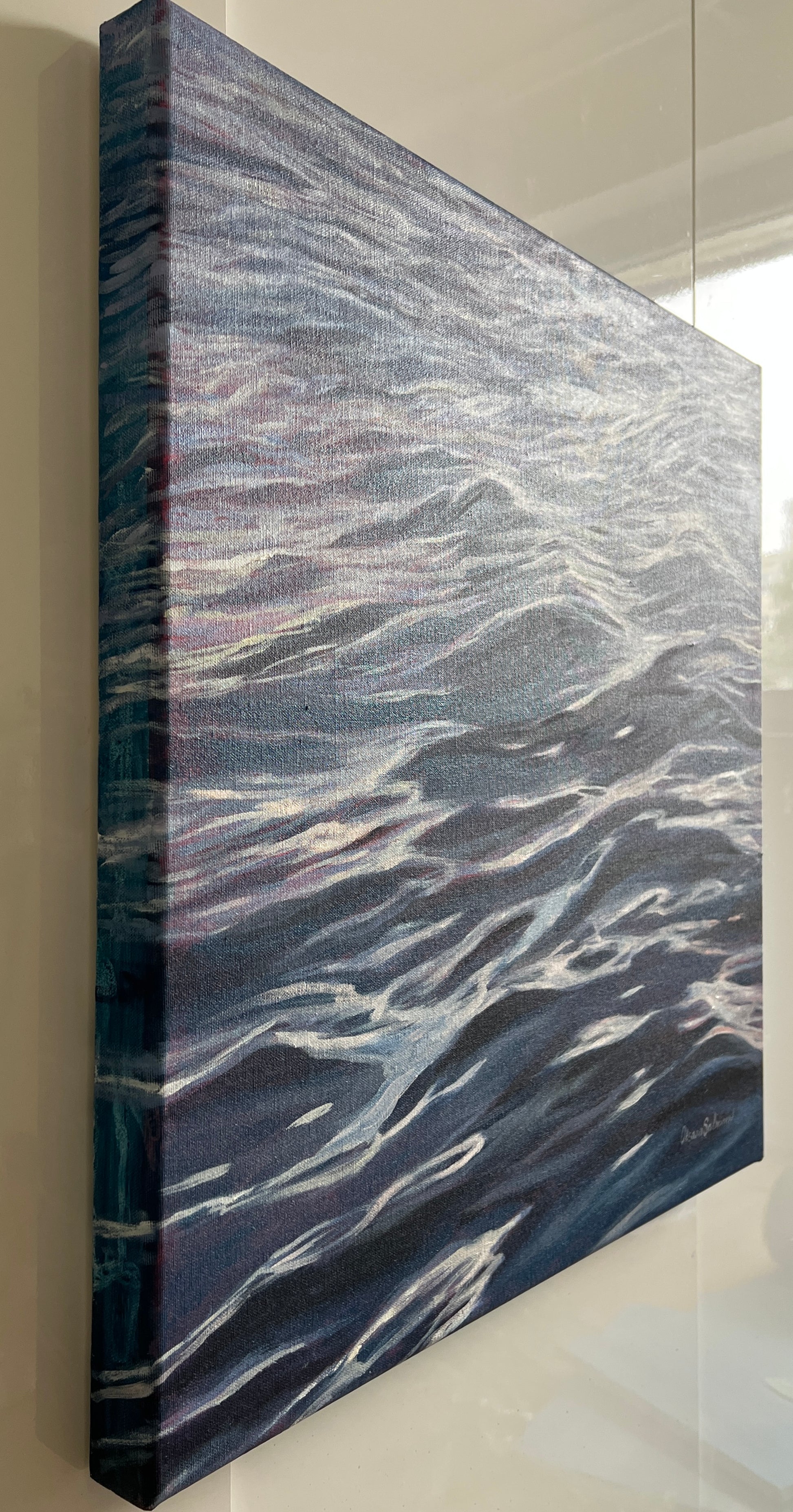 Abstract art piece with wavy patterns on a textured surface