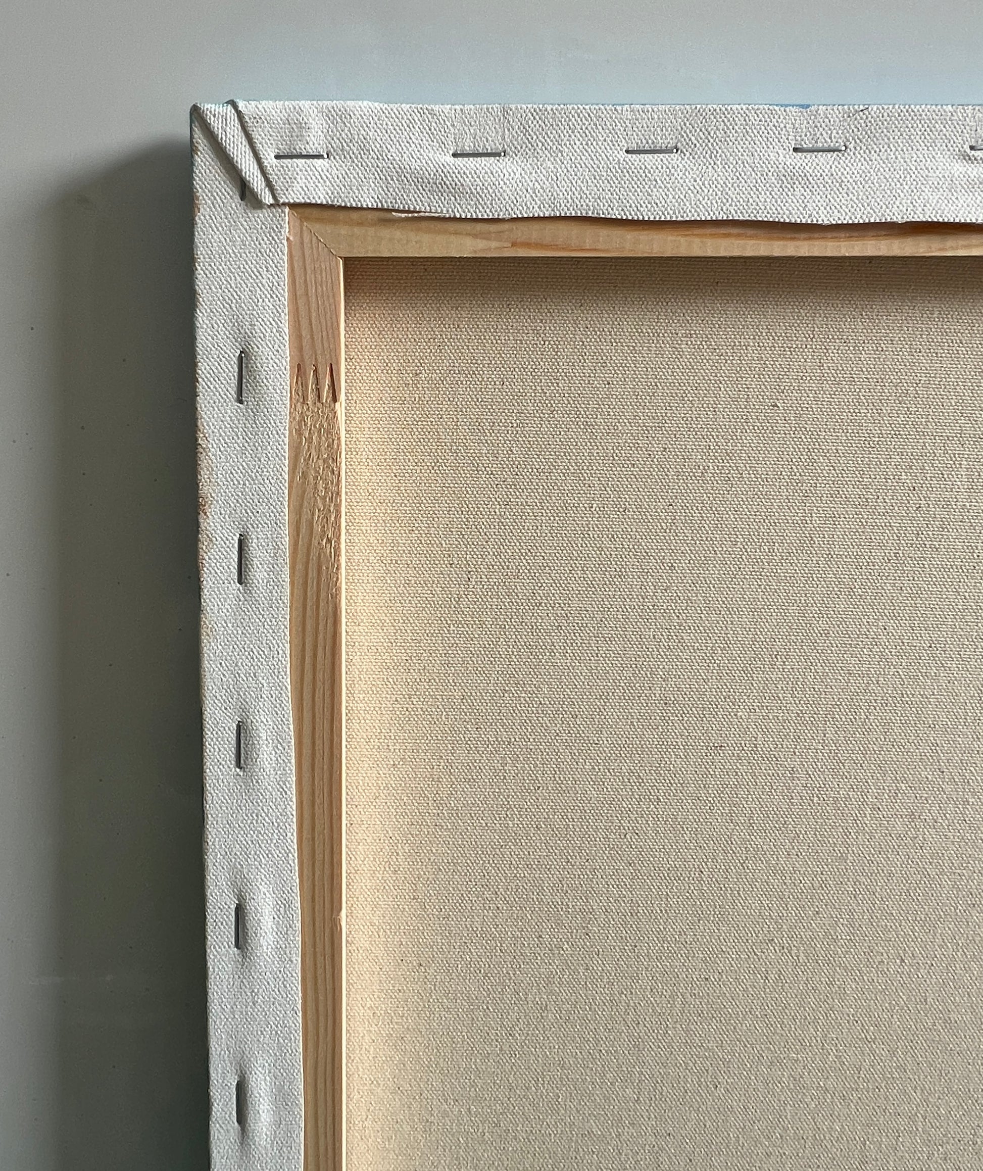 Close-up of a wooden picture frame  on a gray background.