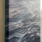 Abstract art piece with wavy patterns on a textured surface