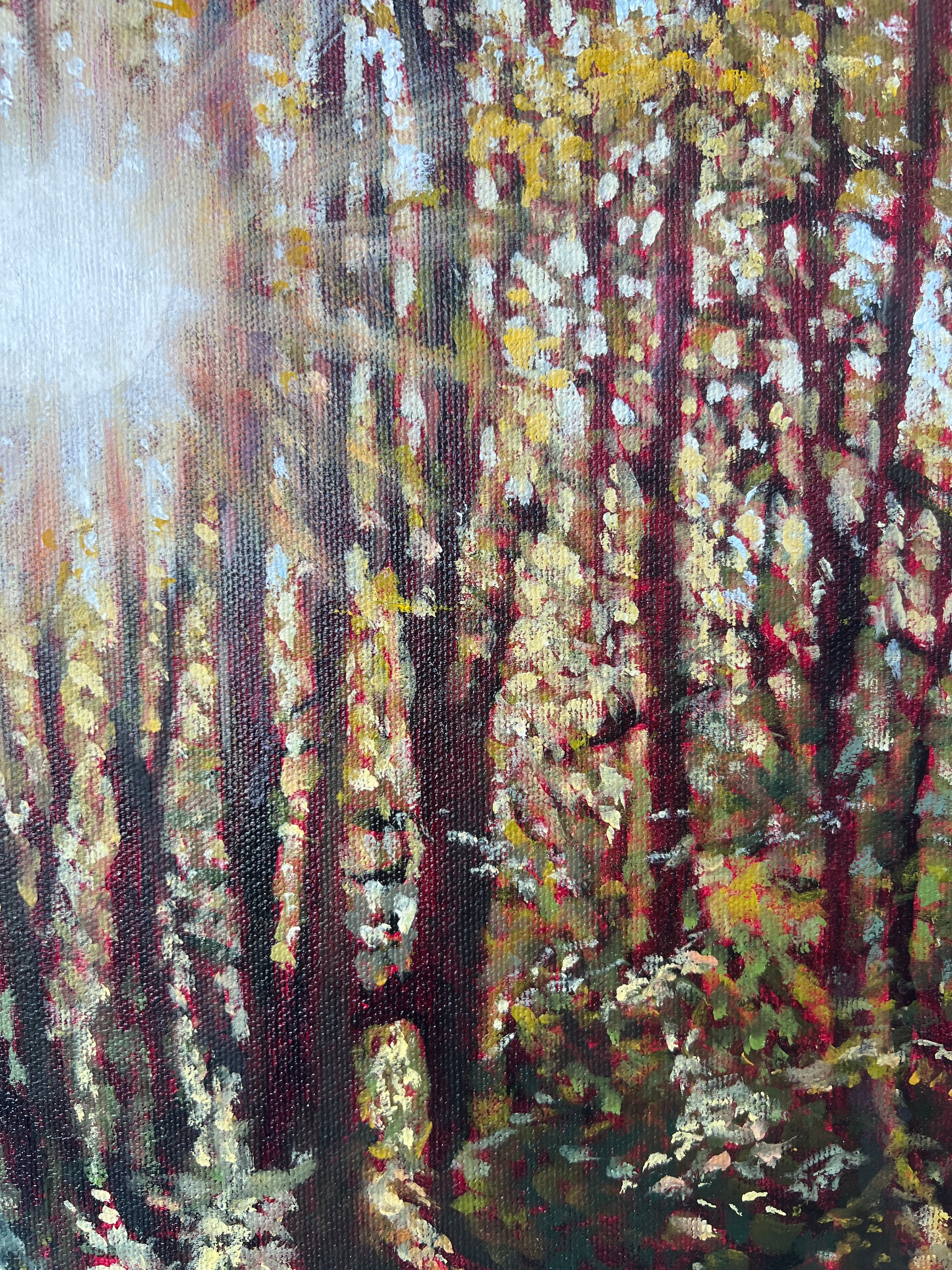 Close-up of a textured fabric with abstract patterns in brown, gold, and white.