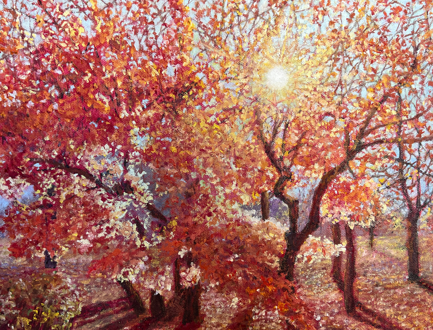 Painting of a sunlit forest with autumn-colored trees