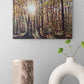 Forest scene painting on a wall above decorative vases.