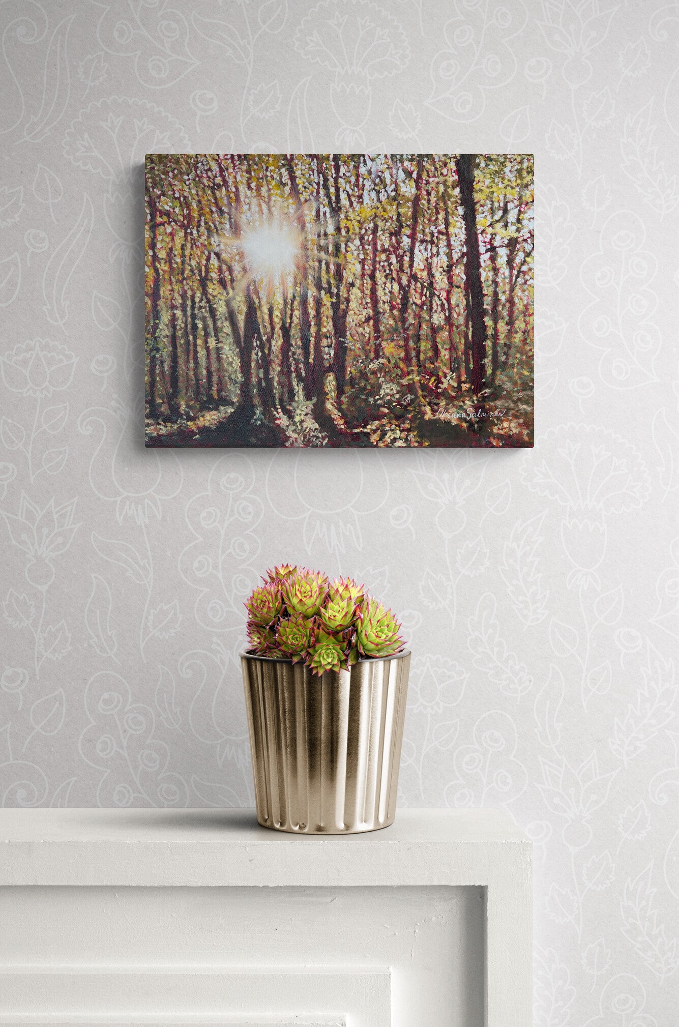 Canvas print of a forest scene with a potted plant on a white surface.